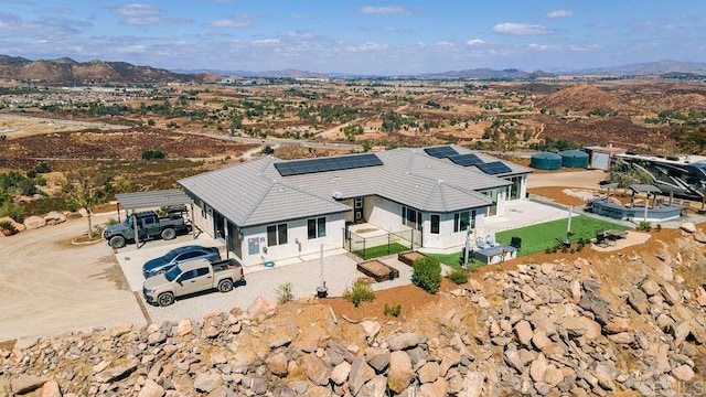 drone / aerial view featuring a mountain view