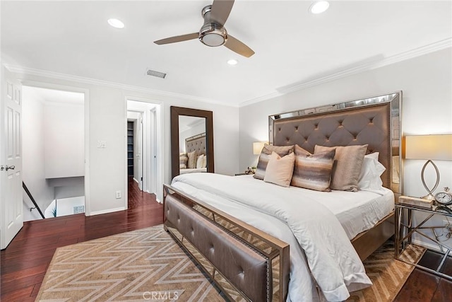 bedroom with recessed lighting, visible vents, ornamental molding, and wood finished floors