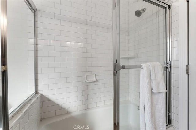 full bath with a tile shower