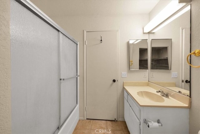 bathroom with tile patterned flooring and vanity