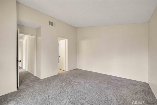 unfurnished bedroom with carpet and visible vents