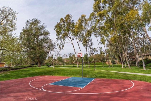 view of sport court featuring community basketball court and a lawn