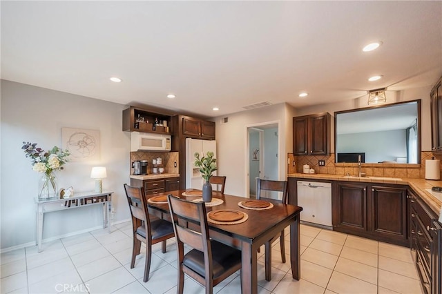 dining area featuring light tile patterned floors, baseboards, visible vents, and recessed lighting