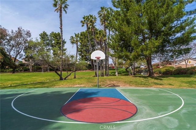 view of sport court with community basketball court and a lawn