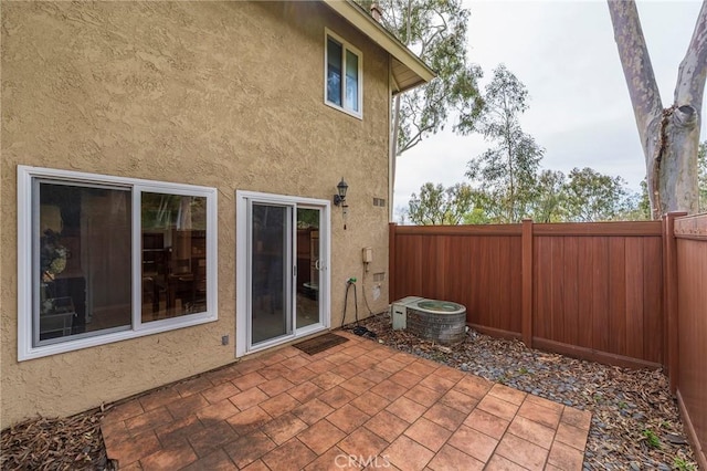 view of patio / terrace featuring a fenced backyard and central AC unit