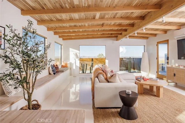 living area featuring wood ceiling, beam ceiling, and a wall mounted AC