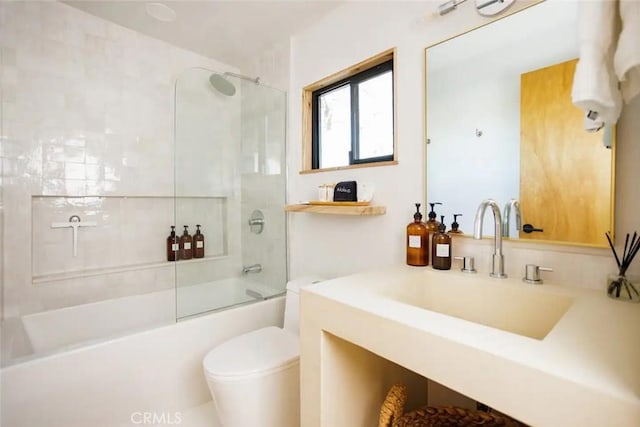 full bathroom featuring shower / bath combination with glass door, vanity, and toilet