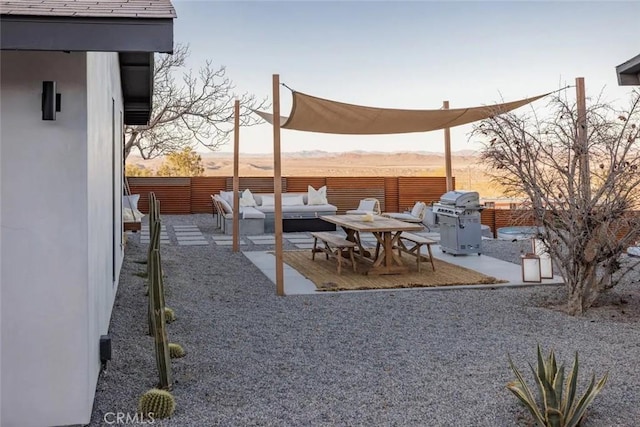 view of yard with a patio area, fence, and an outdoor hangout area