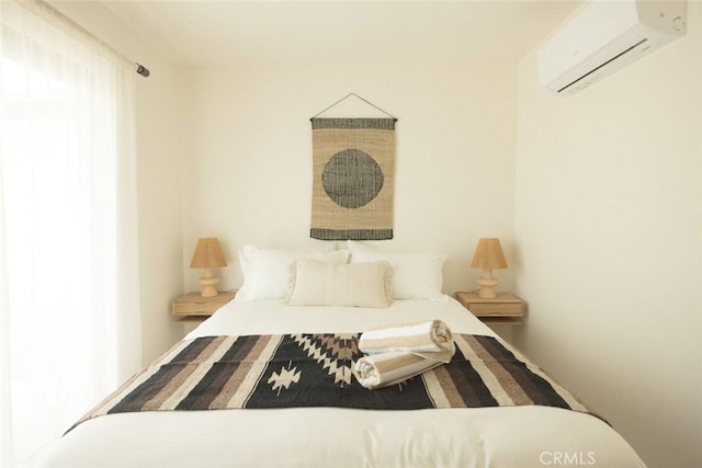 bedroom featuring a wall unit AC