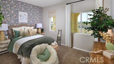 bedroom featuring baseboards, an accent wall, carpet flooring, and wallpapered walls