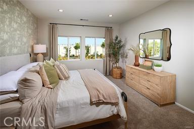 carpeted bedroom featuring recessed lighting