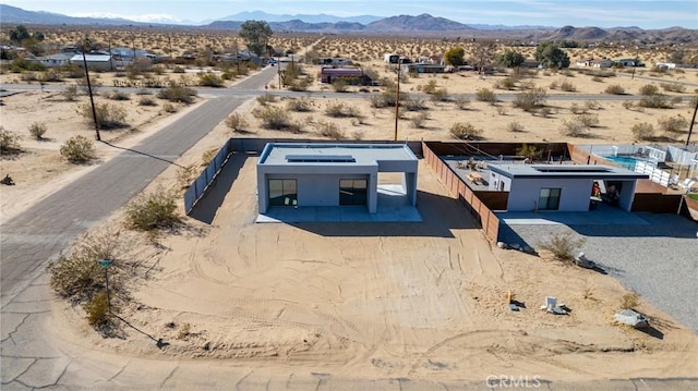 exterior space featuring a mountain view and view of desert