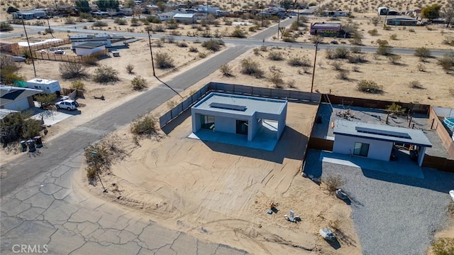 drone / aerial view with view of desert