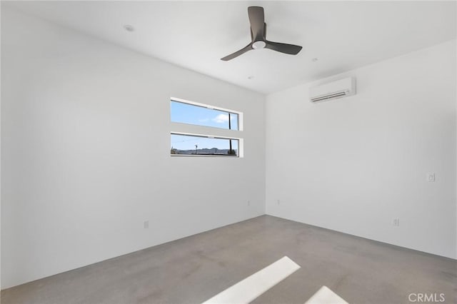 empty room with concrete flooring, a ceiling fan, and a wall mounted AC