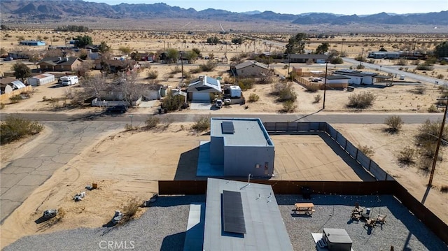 birds eye view of property featuring a rural view, a desert view, and a mountain view