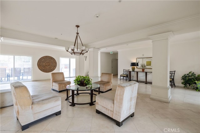 living room with light tile patterned floors, decorative columns, a chandelier, and crown molding