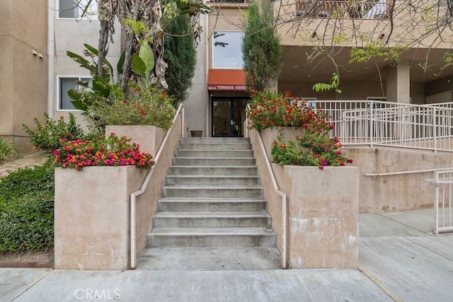 property entrance featuring stucco siding