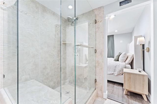 ensuite bathroom with a stall shower and ensuite bath