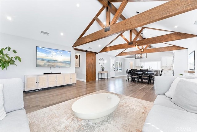 living room with visible vents, wood finished floors, beamed ceiling, high vaulted ceiling, and recessed lighting