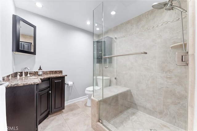 full bath featuring toilet, recessed lighting, vanity, baseboards, and a shower stall