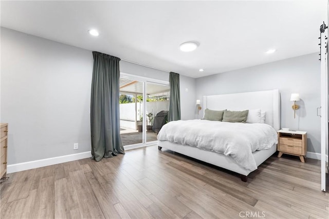 bedroom featuring access to exterior, recessed lighting, light wood-style flooring, and baseboards