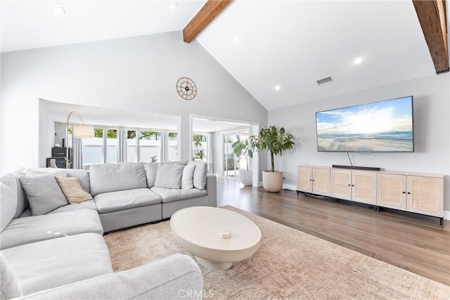 living room with high vaulted ceiling, recessed lighting, wood finished floors, visible vents, and beamed ceiling