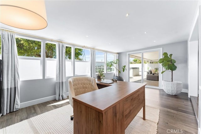 home office with wood finished floors and baseboards