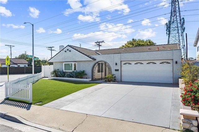 single story home featuring a garage, concrete driveway, stucco siding, fence, and a front yard