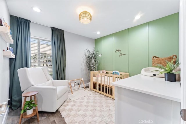 bedroom with light wood-type flooring and recessed lighting