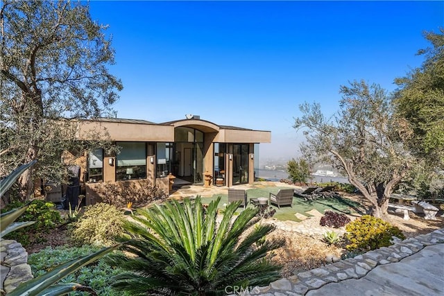 exterior space featuring stucco siding and a patio