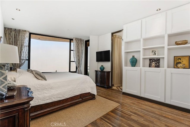 bedroom featuring wood finished floors