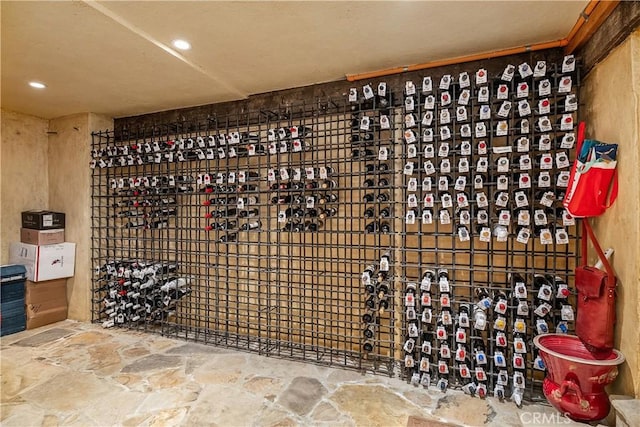 wine cellar featuring recessed lighting and stone floors