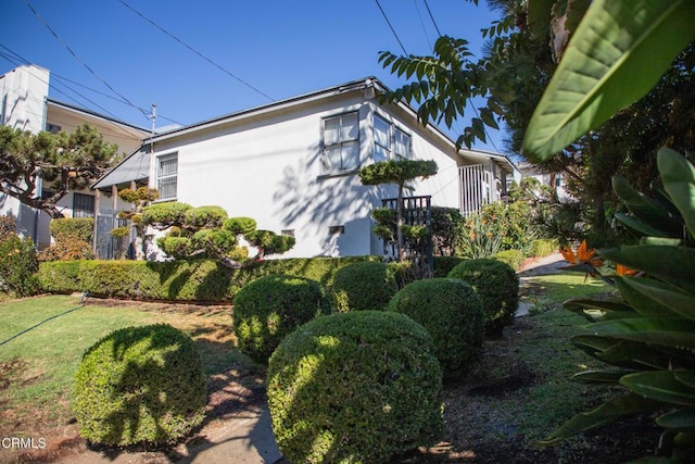 view of home's exterior with a yard