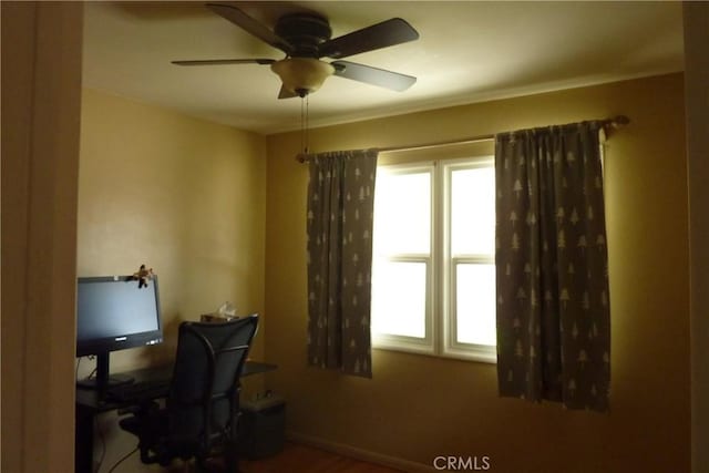 office space with ceiling fan and a wealth of natural light