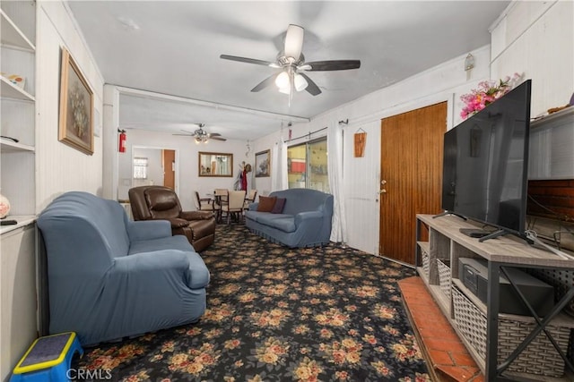 carpeted living room featuring a ceiling fan