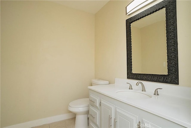 half bath featuring toilet, tile patterned flooring, baseboards, and vanity