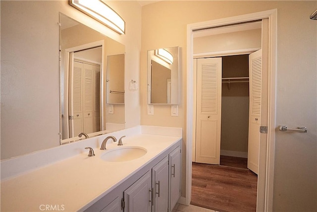 bathroom featuring a closet and vanity