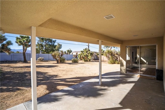 view of patio / terrace featuring fence