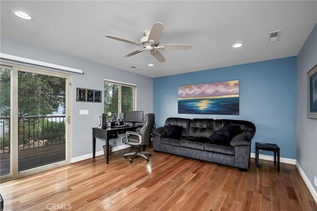 office space with recessed lighting, baseboards, visible vents, and light wood finished floors