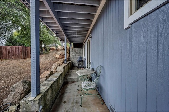 view of side of home with fence