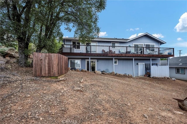 rear view of house with a wooden deck