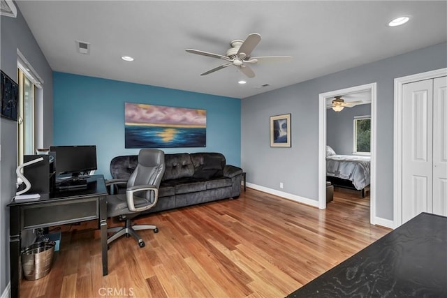 office with recessed lighting, visible vents, a ceiling fan, baseboards, and light wood finished floors