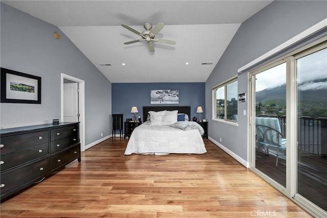 bedroom with vaulted ceiling, light wood-type flooring, visible vents, and access to exterior