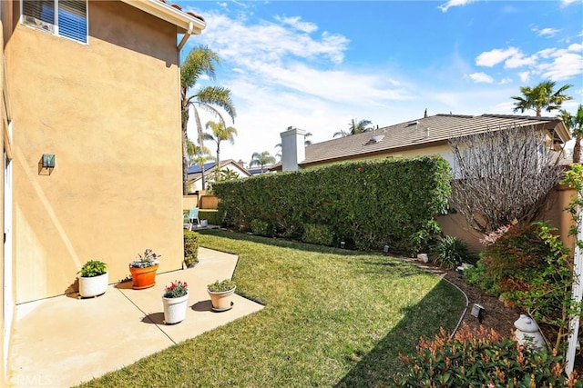 view of yard featuring a patio area and fence