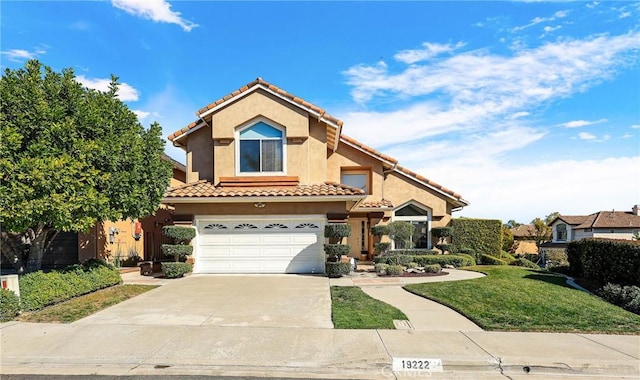 view of front facade featuring a garage, concrete driveway, a tiled roof, a front lawn, and stucco siding