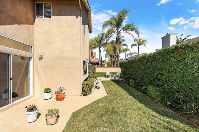 view of yard with a patio area and fence