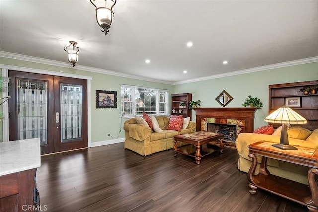 living area featuring french doors, dark wood-style flooring, a premium fireplace, ornamental molding, and baseboards