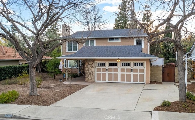 traditional home with a garage, concrete driveway, stone siding, a chimney, and roof with shingles