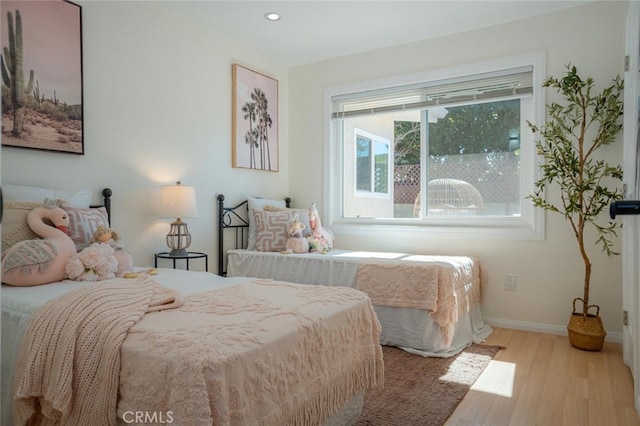 bedroom featuring recessed lighting, baseboards, and wood finished floors