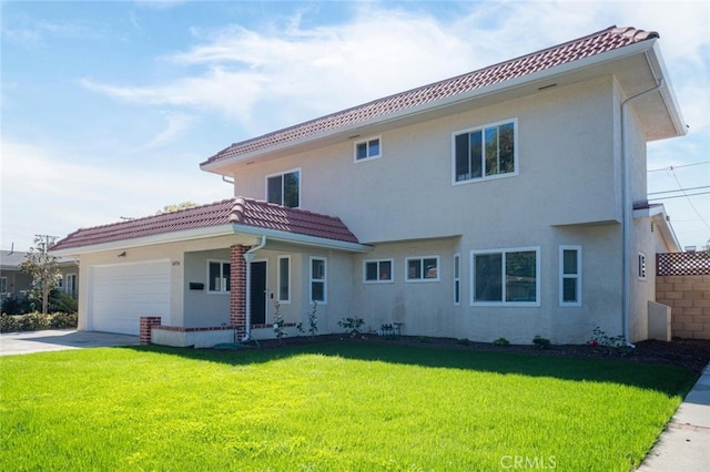 exterior space with a garage, a tile roof, driveway, stucco siding, and a front lawn